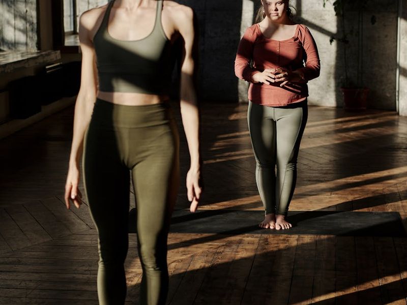 Spacious, well-lit room with yoga mats ready for a class.